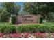 Community entrance sign for Summer Springs surrounded by colorful flowers and lush landscaping at 12802 Cattail Shore Ln, Riverview, FL 33579