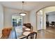 Dining area showcasing a large table and bench seating with tile floors at 12802 Cattail Shore Ln, Riverview, FL 33579