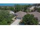 Aerial view shows a single-Gathering home with a two-car garage, well-maintained lawn and landscaping at 12802 Cattail Shore Ln, Riverview, FL 33579