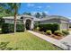 Close up of a home showcasing its welcoming entrance and manicured landscaping at 12802 Cattail Shore Ln, Riverview, FL 33579