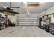 Well-organized garage featuring shelving, storage, and an automatic door opener at 12802 Cattail Shore Ln, Riverview, FL 33579