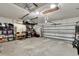 View of the spacious garage with storage shelves and an automatic garage door at 12802 Cattail Shore Ln, Riverview, FL 33579