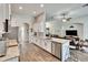 Modern kitchen boasts granite countertops, stainless appliances, and open-concept design at 12802 Cattail Shore Ln, Riverview, FL 33579