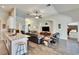 Open-concept living room features wood-look tile, neutral colors, and seamless flow to other spaces at 12802 Cattail Shore Ln, Riverview, FL 33579