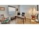 Comfortable home office featuring a desk, office chair, and a rocking chair at 12802 Cattail Shore Ln, Riverview, FL 33579