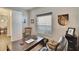 Well-lit office space with a desk, an office chair, and a window at 12802 Cattail Shore Ln, Riverview, FL 33579