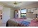 Cozy bedroom with a window view and a ceiling fan for comfortable living at 268 Cory St, Port Charlotte, FL 33953
