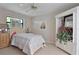 Bright bedroom with ample natural light, patterned bedding, and decorative accents at 268 Cory St, Port Charlotte, FL 33953