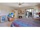 This bedroom features a fireplace, media console, and patio access at 268 Cory St, Port Charlotte, FL 33953