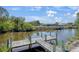 Private dock with boat access surrounded by lush tropical foliage at 268 Cory St, Port Charlotte, FL 33953