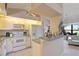 Bright, functional kitchen with ample counter space and white appliances, perfect for meal preparation at 268 Cory St, Port Charlotte, FL 33953