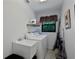 Functional laundry room with modern washer, dryer, and convenient utility sink at 268 Cory St, Port Charlotte, FL 33953