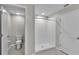 Bathroom showcasing a walk-in shower, a toilet, and tile floors at 10357 Scarlet Skimmer Dr, Riverview, FL 33578