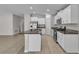 Spacious kitchen with white cabinets, granite countertops, and stainless steel appliances at 10357 Scarlet Skimmer Dr, Riverview, FL 33578