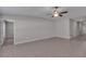 An open-concept living room with tile floors and a ceiling fan at 10357 Scarlet Skimmer Dr, Riverview, FL 33578