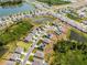 An aerial view of a community highlighting lakefront living, community ponds, and neighborhood streetscapes at 1220 Tahitian Sunrise Dr, Plant City, FL 33565