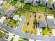 This aerial view shows the vacant lot and the neighborhood amenities, including a basketball court, and community feel at 1220 Tahitian Sunrise Dr, Plant City, FL 33565