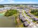 A vibrant neighborhood with lush landscaping, lake views, and well-maintained homes at 1220 Tahitian Sunrise Dr, Plant City, FL 33565