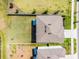 Aerial view of the house highlighting its roof, backyard, and proximity to the street at 1220 Tahitian Sunrise Dr, Plant City, FL 33565