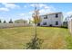 Expansive backyard with lush lawn and a privacy fence at 1220 Tahitian Sunrise Dr, Plant City, FL 33565