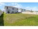 A spacious backyard featuring a well-maintained lawn and privacy fence at 1220 Tahitian Sunrise Dr, Plant City, FL 33565