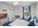 Inviting bedroom with lake view, ceiling fan, and decor at 1220 Tahitian Sunrise Dr, Plant City, FL 33565