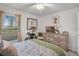Comfortable bedroom view with a large window and natural light at 1220 Tahitian Sunrise Dr, Plant City, FL 33565