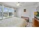 Well-lit bedroom offering views of the lush outdoors at 1220 Tahitian Sunrise Dr, Plant City, FL 33565