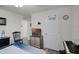 Cozy bedroom with a TV and decorative chair at 1220 Tahitian Sunrise Dr, Plant City, FL 33565