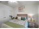 Bedroom features a ceiling fan and a lamp on the nightstand at 1220 Tahitian Sunrise Dr, Plant City, FL 33565