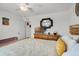 Bright bedroom featuring a well-lit dresser and wood-slat headboard at 1220 Tahitian Sunrise Dr, Plant City, FL 33565