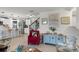 Living room view with kitchen and staircase, cozy seating and stylish decor at 1220 Tahitian Sunrise Dr, Plant City, FL 33565