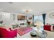 Bright living room with fireplace, decorative accents, and inviting furniture arrangement at 1220 Tahitian Sunrise Dr, Plant City, FL 33565