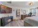 Spacious main bedroom with a TV, electric fireplace, and a view to the bathroom at 1220 Tahitian Sunrise Dr, Plant City, FL 33565