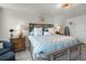 Charming main bedroom featuring a plush bed, lamps, and soothing decor at 1220 Tahitian Sunrise Dr, Plant City, FL 33565