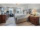 Well-lit main bedroom featuring a plush bed, wooden furniture, and a calming color scheme at 1220 Tahitian Sunrise Dr, Plant City, FL 33565
