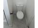 Bathroom with a new, low-flow toilet and marble-look tile floor at 12219 Armenia Gables Cir, Tampa, FL 33612