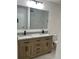 Bathroom featuring double sink vanity with a gray and white granite top at 12219 Armenia Gables Cir, Tampa, FL 33612