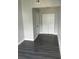 Empty bedroom with wood-look flooring and double door closet at 12219 Armenia Gables Cir, Tampa, FL 33612
