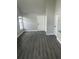 The living room features wood floors, neutral paint, and two entry doors at 12219 Armenia Gables Cir, Tampa, FL 33612