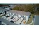 Aerial view of modern townhomes, showcasing well-manicured landscaping and parking spaces at 1570 Hubbell Rd, Wesley Chapel, FL 33543