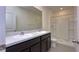 Modern bathroom featuring double sinks, granite countertops and a spacious shower at 1570 Hubbell Rd, Wesley Chapel, FL 33543