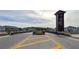 A grand entrance to the community featuring decorative landscaping and architectural details at 1570 Hubbell Rd, Wesley Chapel, FL 33543
