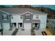 Modern townhouses with neutral exteriors, individual garages and manicured landscaping create curb appeal at 1570 Hubbell Rd, Wesley Chapel, FL 33543