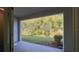Covered patio overlooking a lush green backyard providing outdoor relaxation at 1570 Hubbell Rd, Wesley Chapel, FL 33543