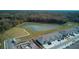 Scenic view of the community pond surrounded by lush greenery and neighborhood at 1570 Hubbell Rd, Wesley Chapel, FL 33543