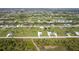 Community aerial featuring multiple residences, waterways, and lush landscaping at 205 Rotonda S Blvd, Rotonda West, FL 33947