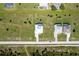 Overhead shot showing multiple residences in a neighborhood featuring houses with swimming pools at 205 Rotonda S Blvd, Rotonda West, FL 33947