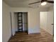 Bedroom featuring wood-look flooring and a reach-in closet at 2055 Lakeview Dr, Clearwater, FL 33763