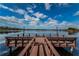 Scenic view of a wooden dock extending into a serene lake at 2055 Lakeview Dr, Clearwater, FL 33763